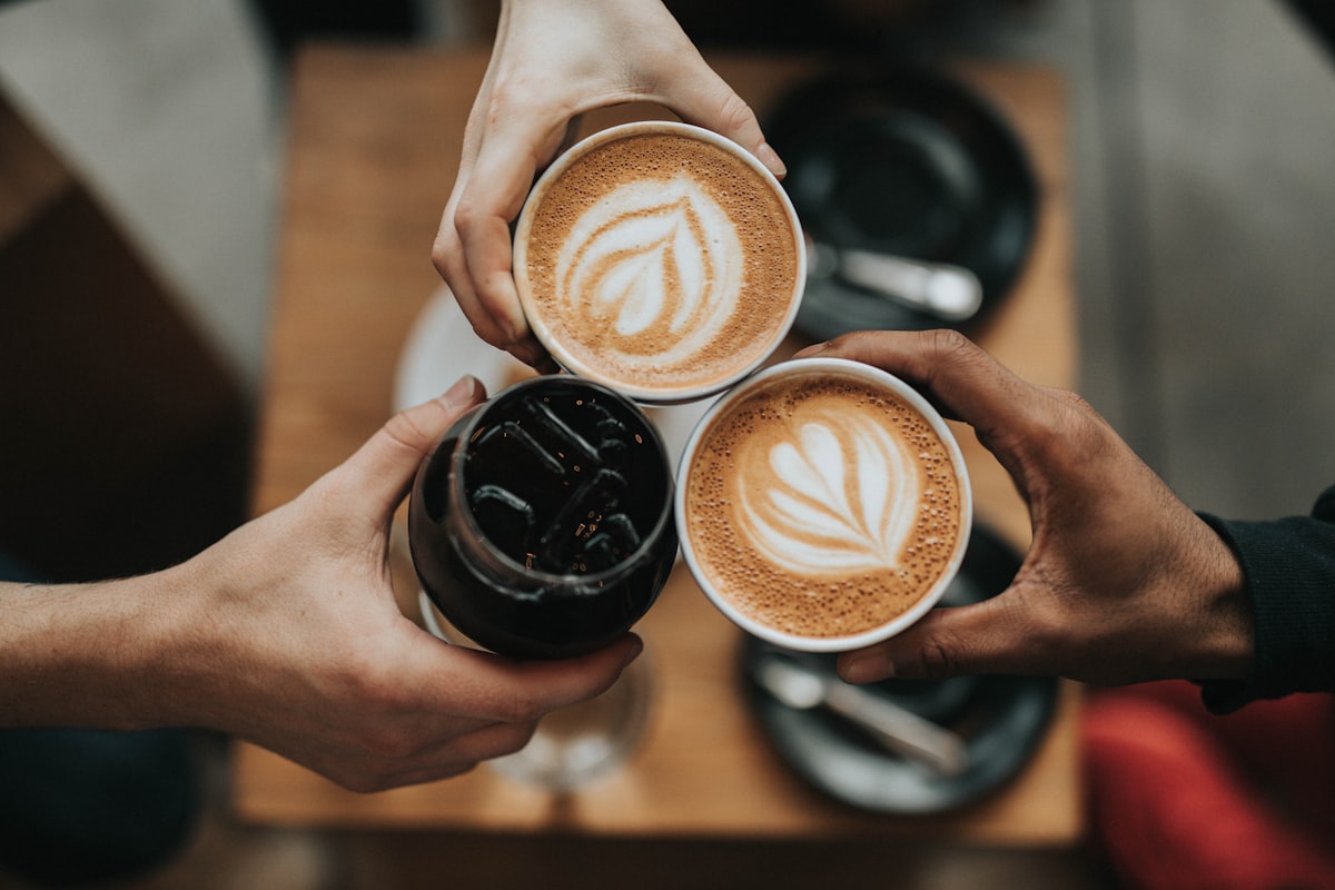 Barista preparing coffee at a modern cafe counter